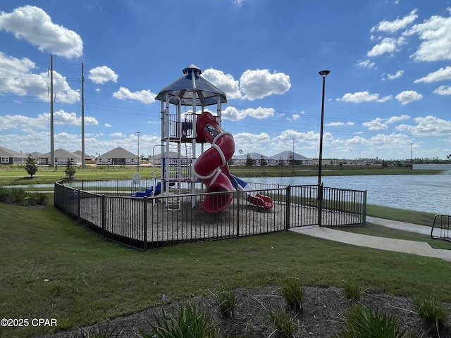 communal playground featuring a lawn