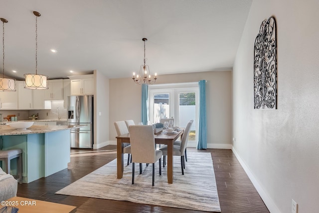 dining space with dark wood-style floors, recessed lighting, an inviting chandelier, and baseboards