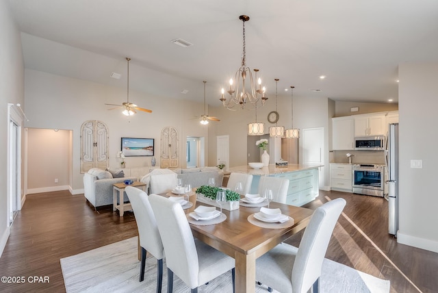 dining room with dark wood-style floors, baseboards, visible vents, and high vaulted ceiling