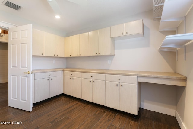 kitchen featuring baseboards, visible vents, dark wood-type flooring, light countertops, and recessed lighting