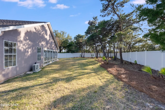 view of yard featuring ac unit and a fenced backyard