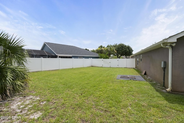 view of yard with a fenced backyard