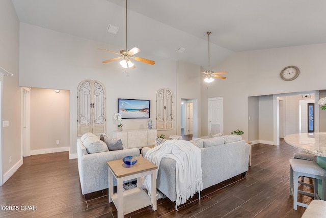 living room with high vaulted ceiling, dark wood finished floors, baseboards, and ceiling fan