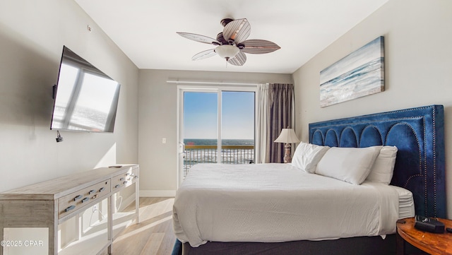 bedroom with access to outside, a ceiling fan, baseboards, and light wood finished floors