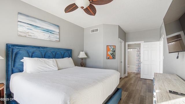 bedroom with ceiling fan, visible vents, and wood finished floors