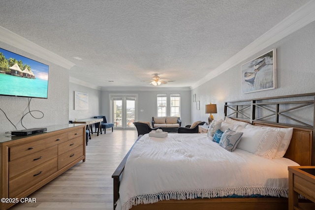 bedroom with crown molding, light wood-type flooring, a textured wall, a textured ceiling, and access to outside