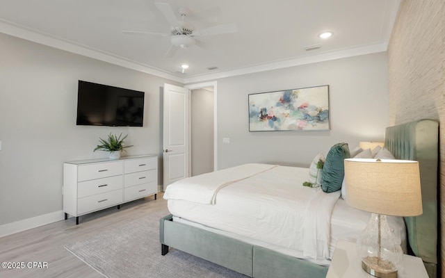 bedroom with ornamental molding, light wood-style floors, baseboards, and ceiling fan