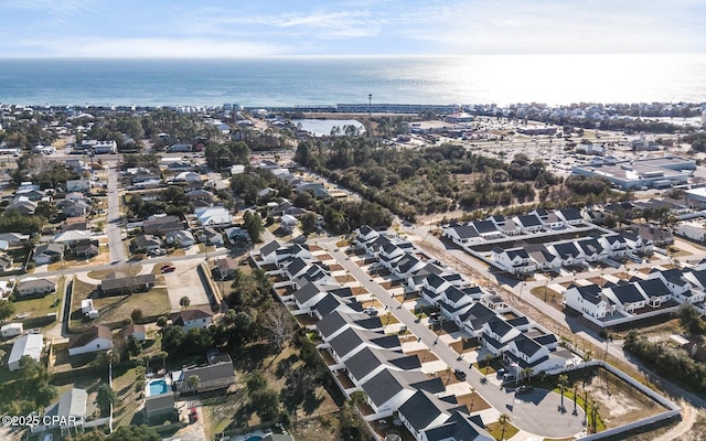 birds eye view of property with a water view and a residential view