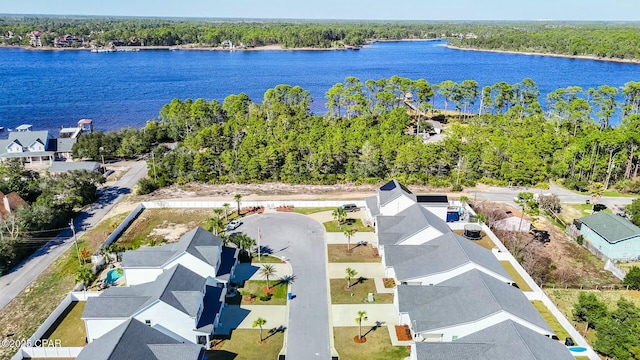 drone / aerial view featuring a water view and a residential view