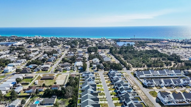 drone / aerial view with a residential view and a water view