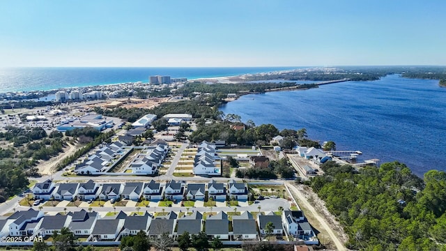 birds eye view of property with a water view and a residential view