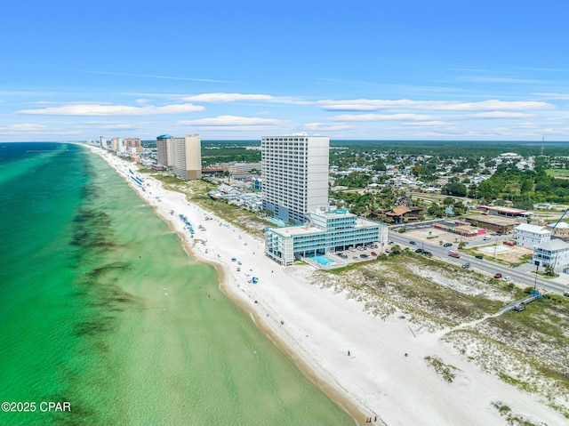 aerial view featuring a city view, a water view, and a beach view