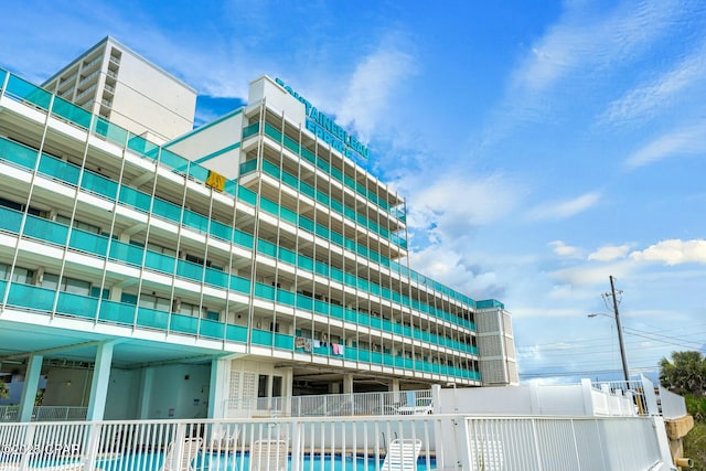 view of building exterior with fence