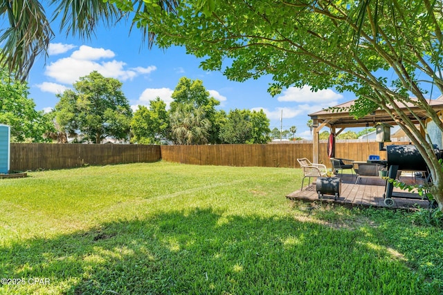 view of yard featuring a gazebo, a patio, and a fenced backyard