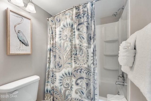 full bathroom with toilet and shower / bath combo with shower curtain