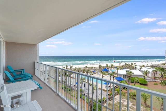 balcony with a view of the beach and a water view