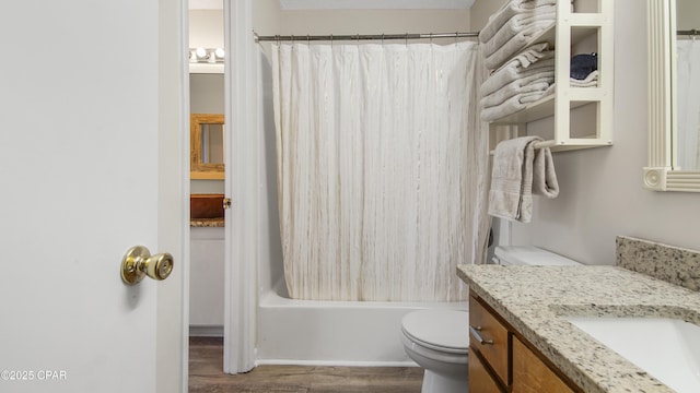 full bathroom featuring shower / bath combo with shower curtain, toilet, vanity, and wood finished floors