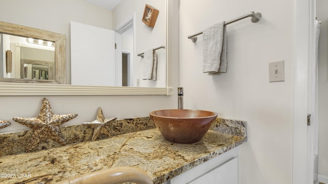 bathroom featuring double vanity and a sink