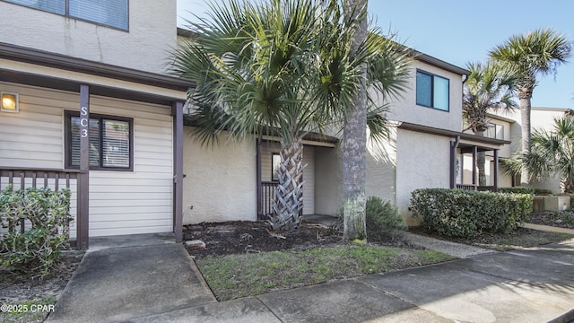 doorway to property with stucco siding