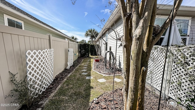 view of side of property with a fenced backyard