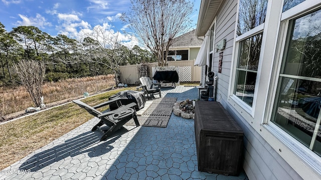 view of patio / terrace featuring fence