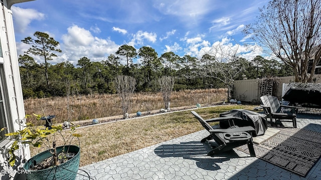 view of patio / terrace featuring fence