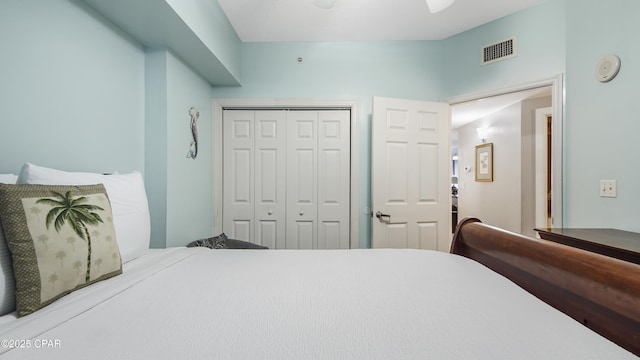 bedroom featuring a closet and visible vents