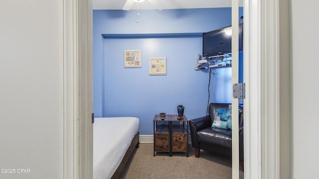 carpeted bedroom with a ceiling fan