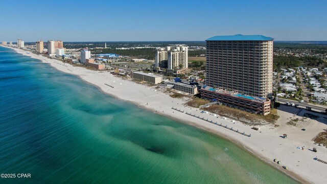 aerial view featuring a city view, a beach view, and a water view