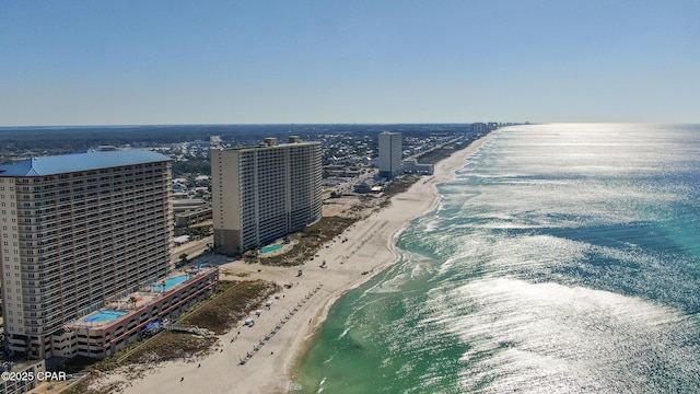 bird's eye view with a water view, a city view, and a view of the beach