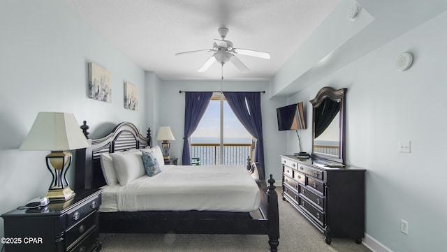 carpeted bedroom with baseboards and a ceiling fan