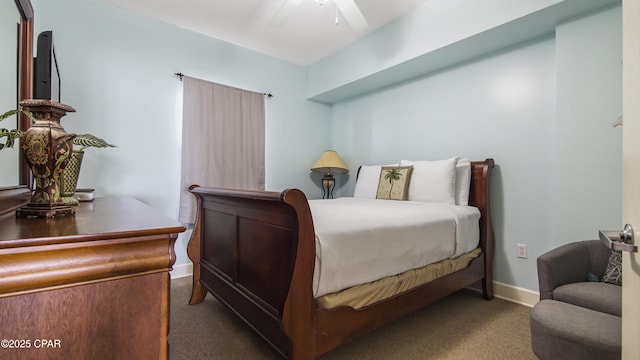 bedroom with a ceiling fan, baseboards, and carpet floors