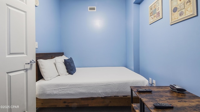 bedroom featuring visible vents