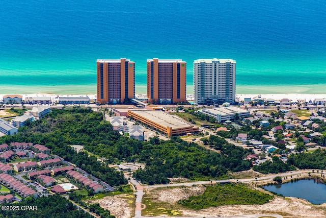 drone / aerial view featuring a view of city and a water view