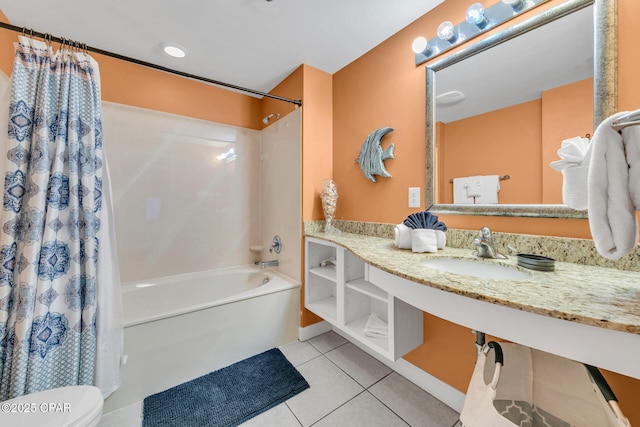 bathroom with toilet, shower / tub combo, vanity, and tile patterned floors