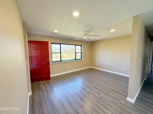 entrance foyer with recessed lighting, wood finished floors, visible vents, and baseboards