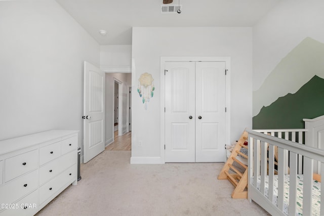 38 Cozy Cv, Freeport, FL 32439 - bedroom with a closet, a crib, baseboards, light colored carpet, and visible vents