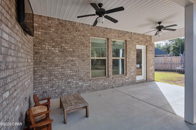 38 Cozy Cv, Freeport, FL 32439 - view of patio / terrace featuring a trampoline, a ceiling fan, and fence