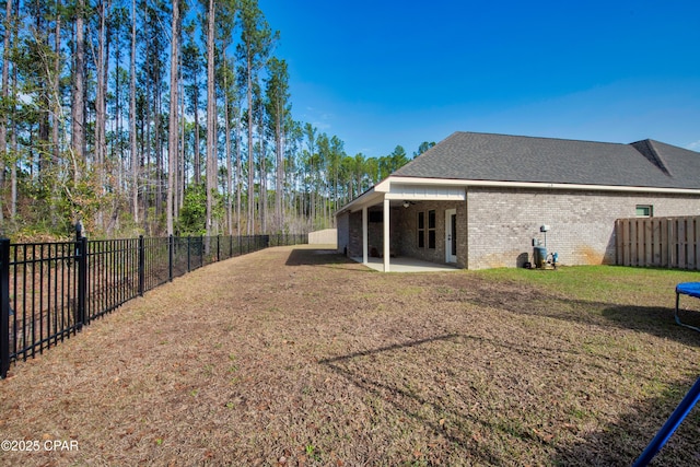 38 Cozy Cv, Freeport, FL 32439 - view of yard featuring a fenced backyard and a patio area