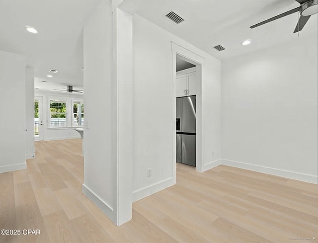 interior space featuring visible vents, recessed lighting, baseboards, and light wood-style floors