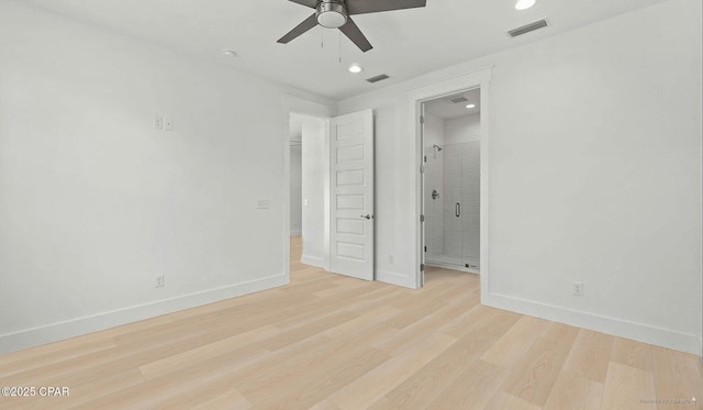 unfurnished bedroom with visible vents, baseboards, and light wood-style floors