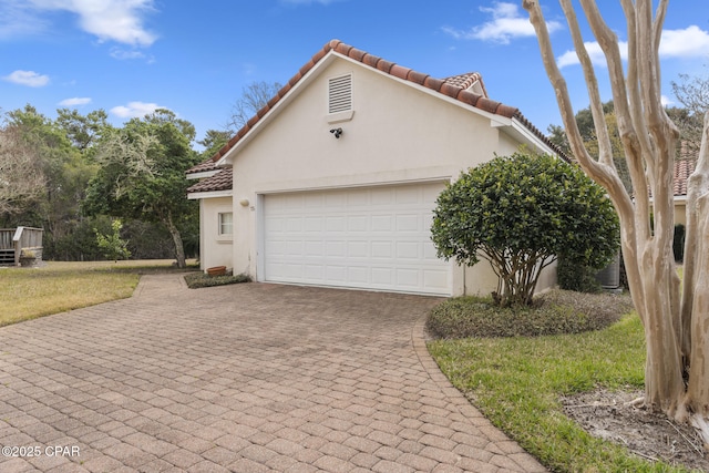 exterior space featuring decorative driveway