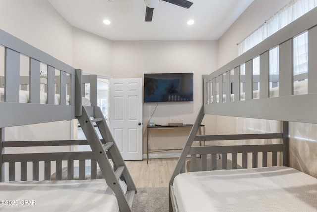 bedroom with recessed lighting and wood finished floors