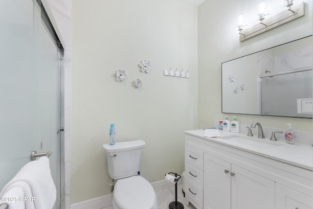 full bathroom with an enclosed shower, toilet, vanity, and baseboards