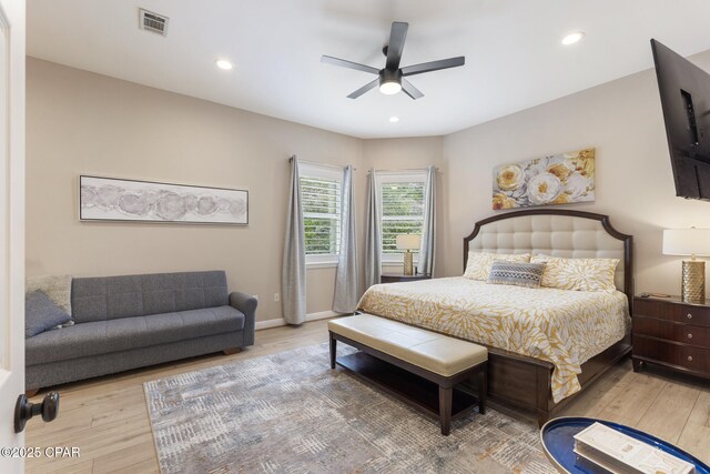 bedroom featuring recessed lighting, wood finished floors, and visible vents