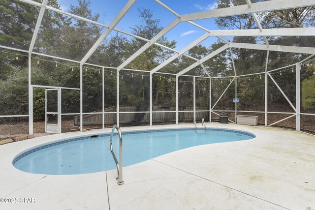 outdoor pool with a patio and a fenced backyard