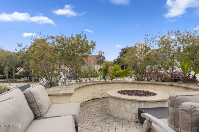 view of patio / terrace with an outdoor fire pit