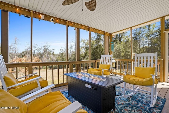 sunroom with a ceiling fan