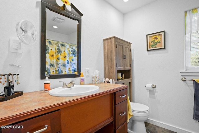 bathroom with toilet, tile patterned flooring, visible vents, and vanity