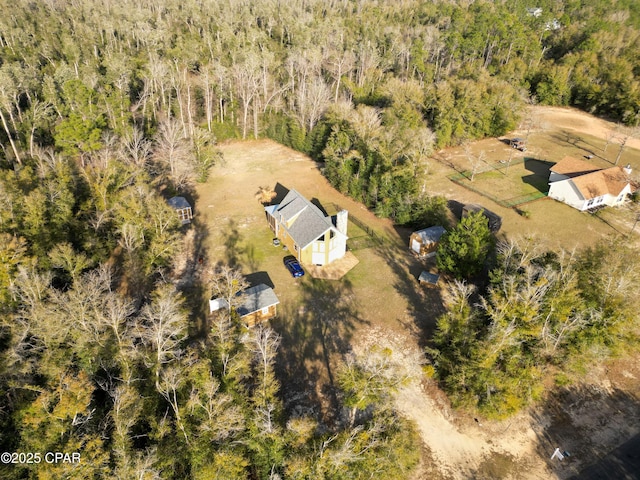 bird's eye view featuring a wooded view